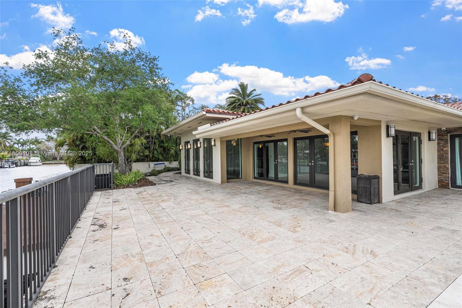 12605 Cyprus Road North Miami, FL 33181 - Photo 45 of 60 a view of a house with a yard