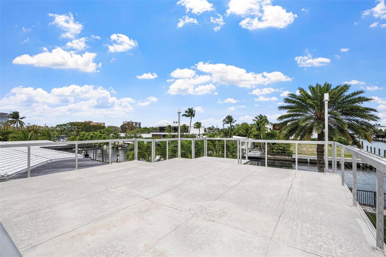 12605 Cyprus Road North Miami, FL 33181 - Photo 49 of 60 a view of a house with a patio