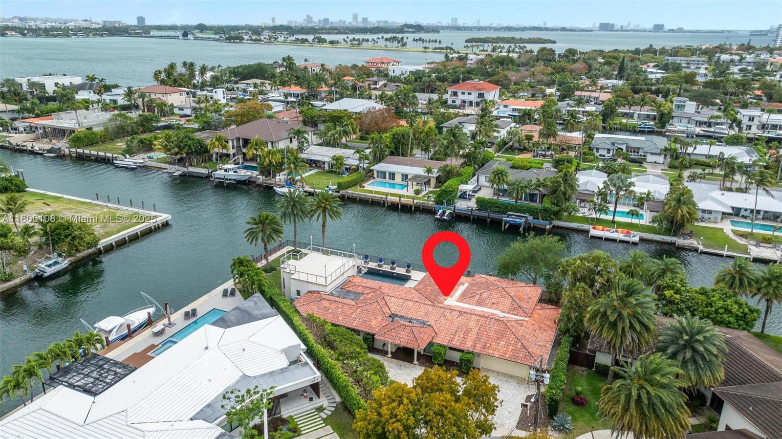 12605 Cyprus Road North Miami, FL 33181 - Photo 54 of 60 an aerial view of a house with a lake view