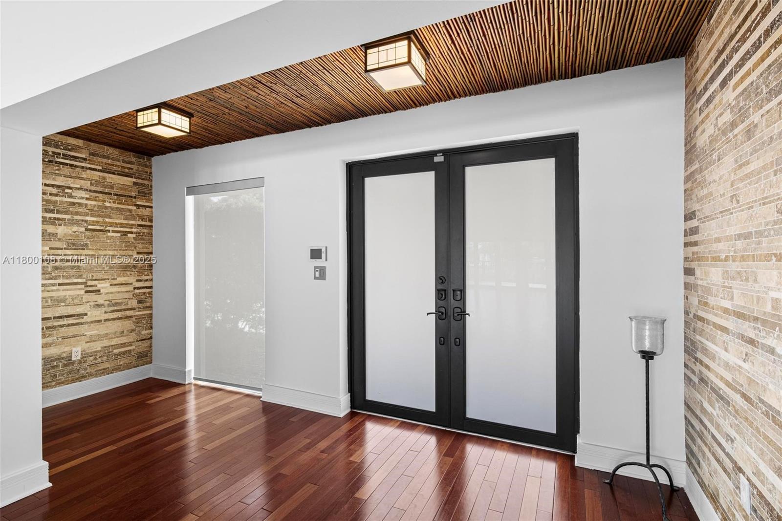 12605 Cyprus Road North Miami, FL 33181 - Photo 6 of 60 an entryway with wooden floor