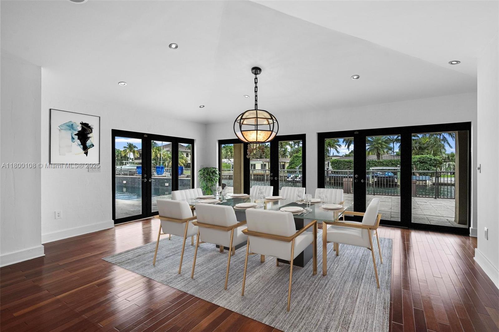 12605 Cyprus Road North Miami, FL 33181 - Photo 9 of 60 a view of a dining room with furniture window and wooden floor