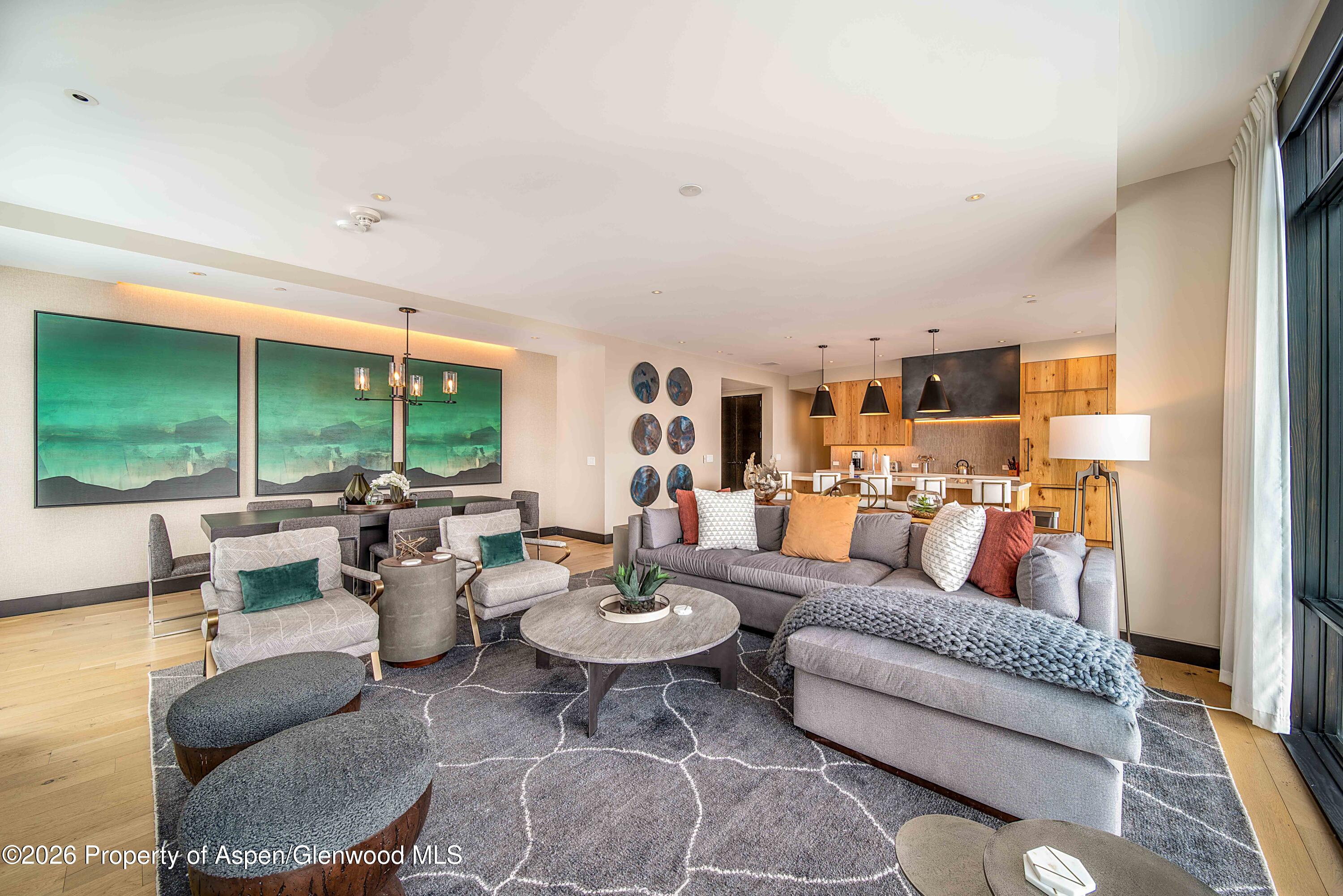 77 Wood Road, Unit 50711 Snowmass Village, CO 81615 - Photo 2 of 20 a living room with furniture and a large window