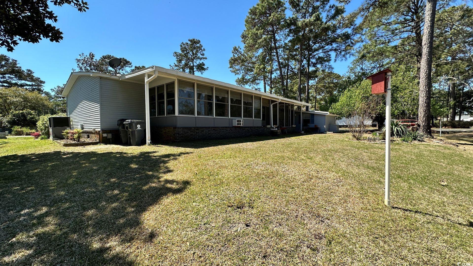 910 Grand Strand Trail Murrells Inlet, SC 29576 - Photo 31 of 33 View of yard featuring a sunroom