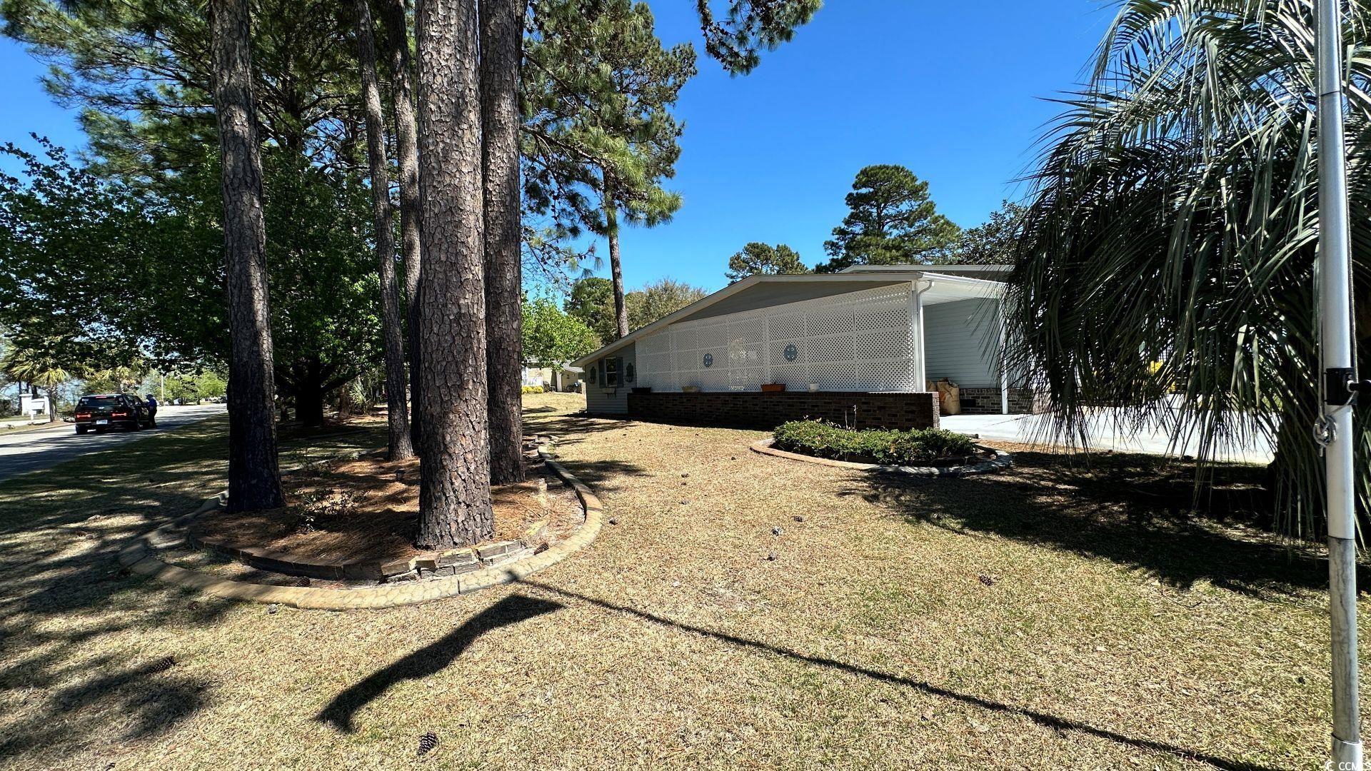 910 Grand Strand Trail Murrells Inlet, SC 29576 - Photo 33 of 33 Rear view of home, workshop and irrigation view