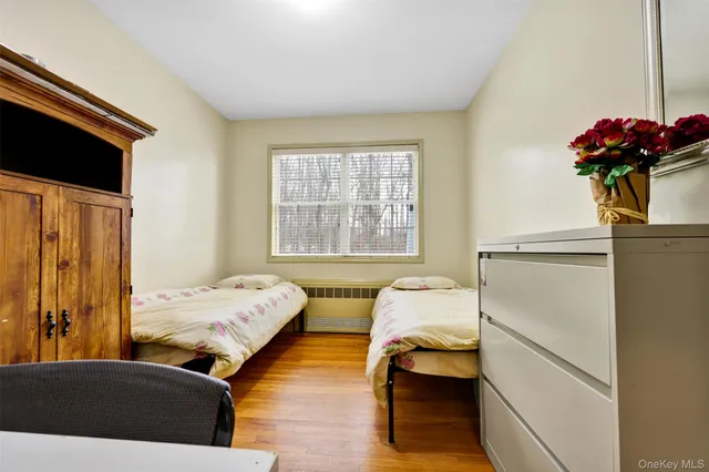 a bedroom with bed and a window