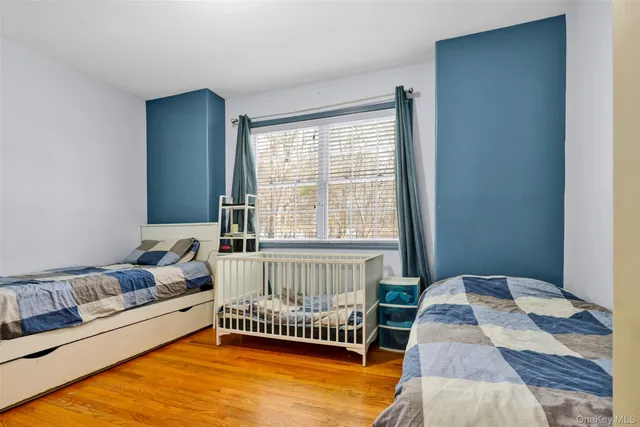 a bed room with a bed and a window