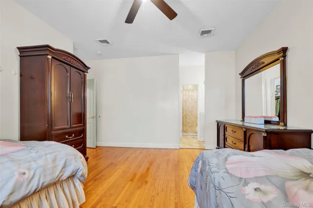a bathroom with a granite countertop sink a toilet and a shower