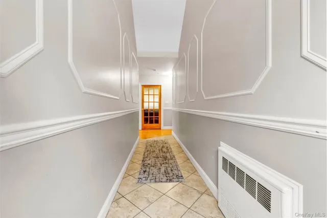 a view of staircase with white walls and a window