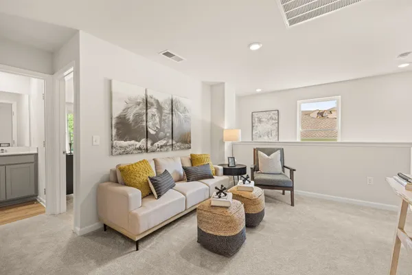 a bedroom with a bed and mirror