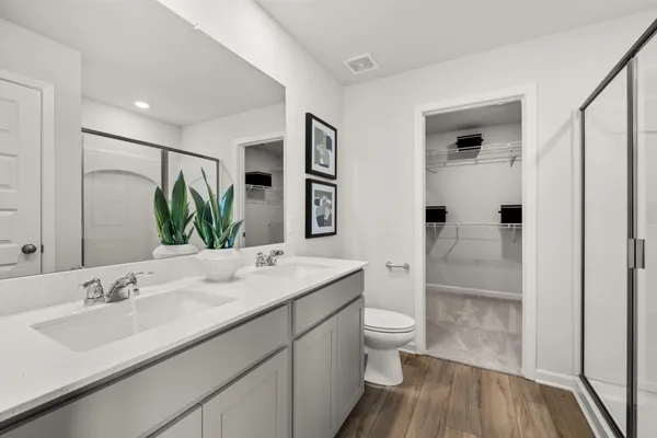 a en suite bathroom with a sink a mirror and a shower