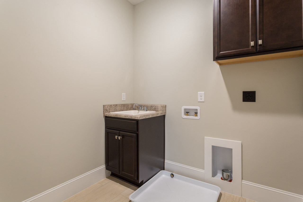 4612 Pleasant Pointe Way Raleigh, NC 27613 - Photo 24 of 25 Sink in Laundry Room