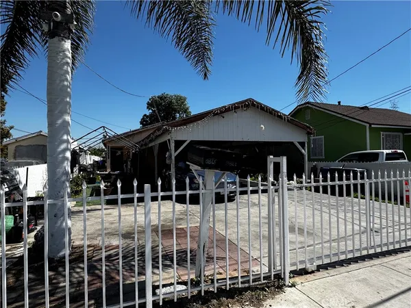 a front view of a house with parking