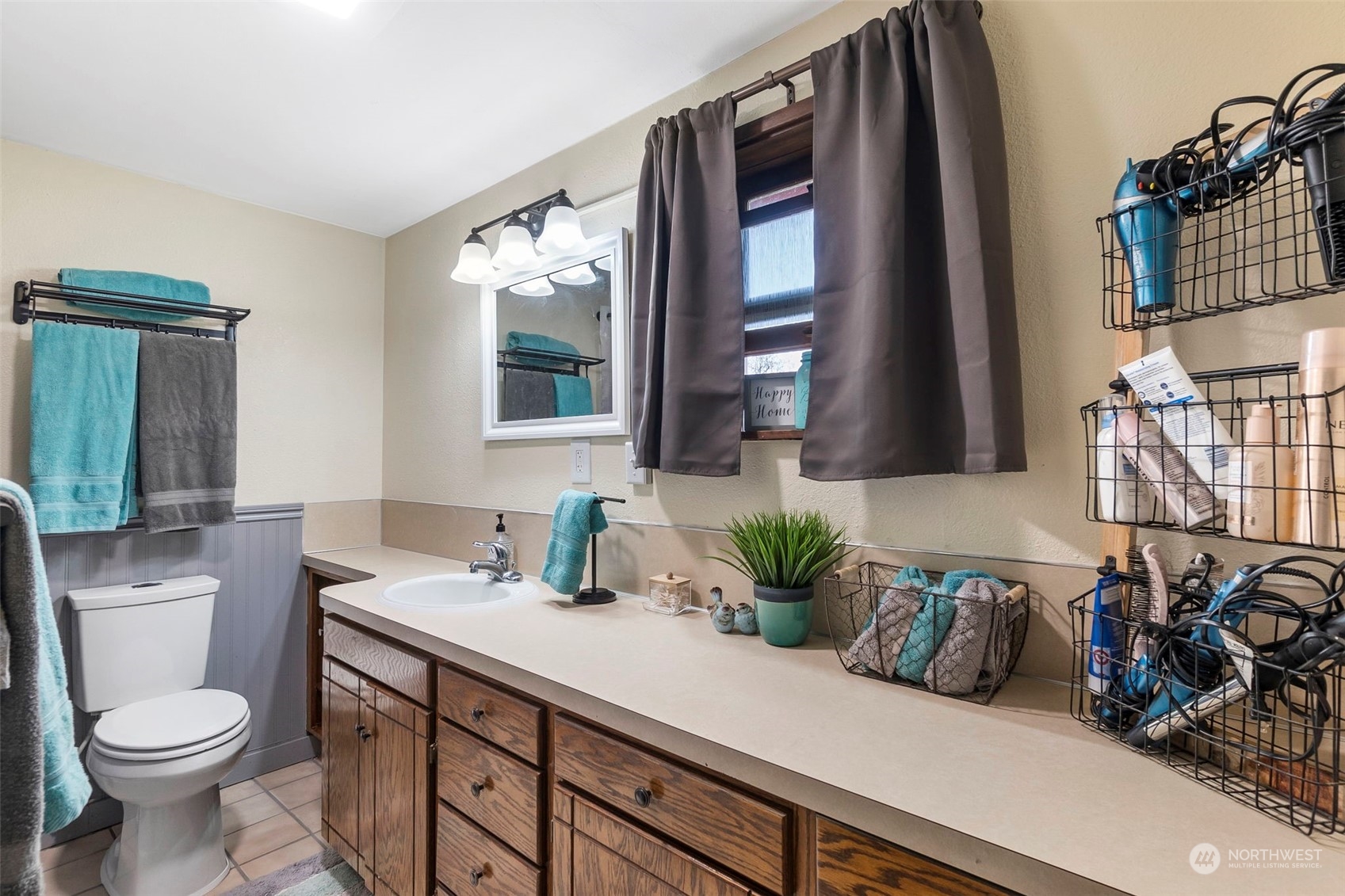 293 Logan Hill Road Chehalis, WA 98532 - Photo 11 of 36 a bathroom with a granite countertop sink a toilet and mirror