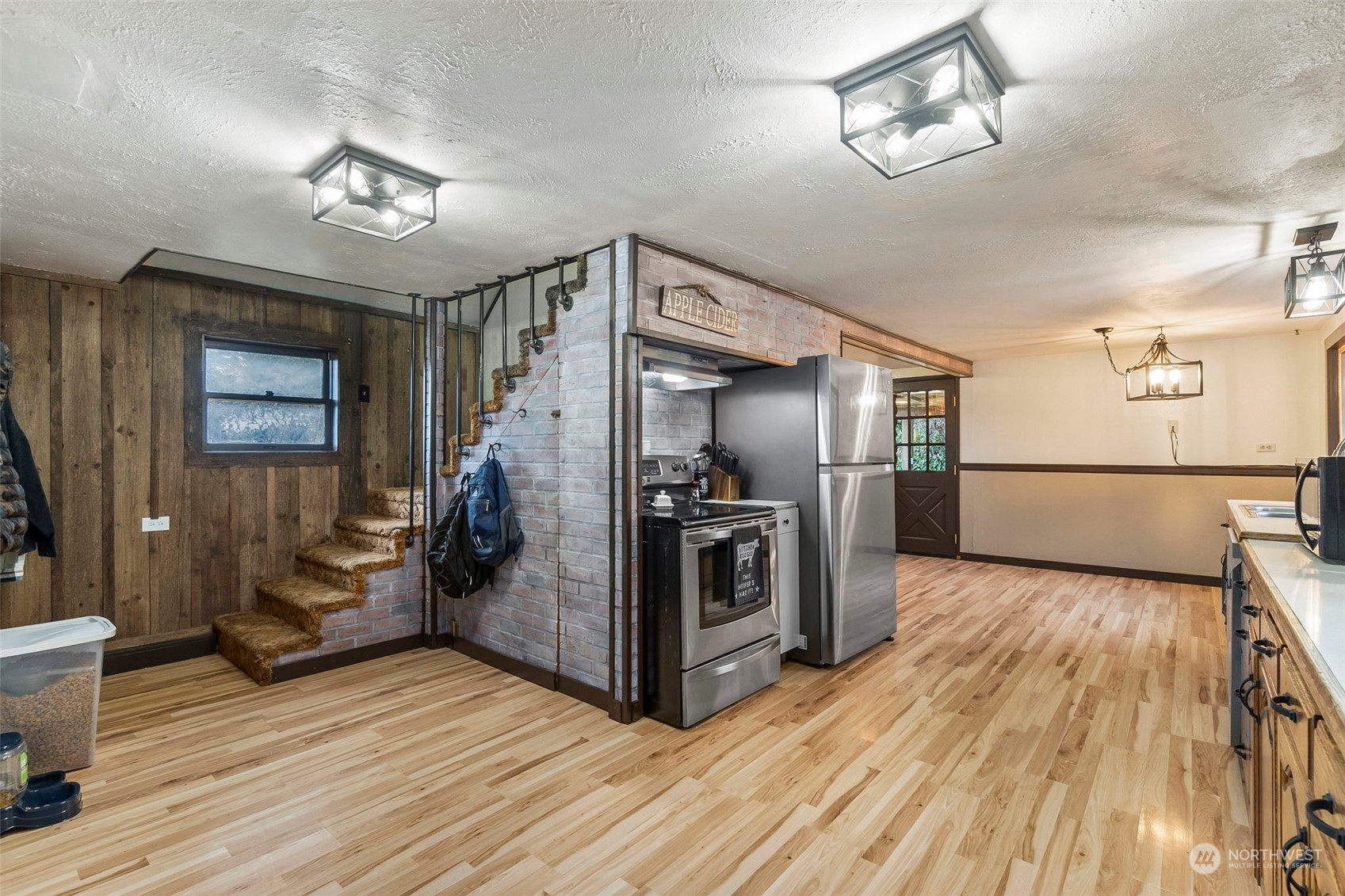 293 Logan Hill Road Chehalis, WA 98532 - Photo 10 of 36 a view of a kitchen with refrigerator and wooden floor