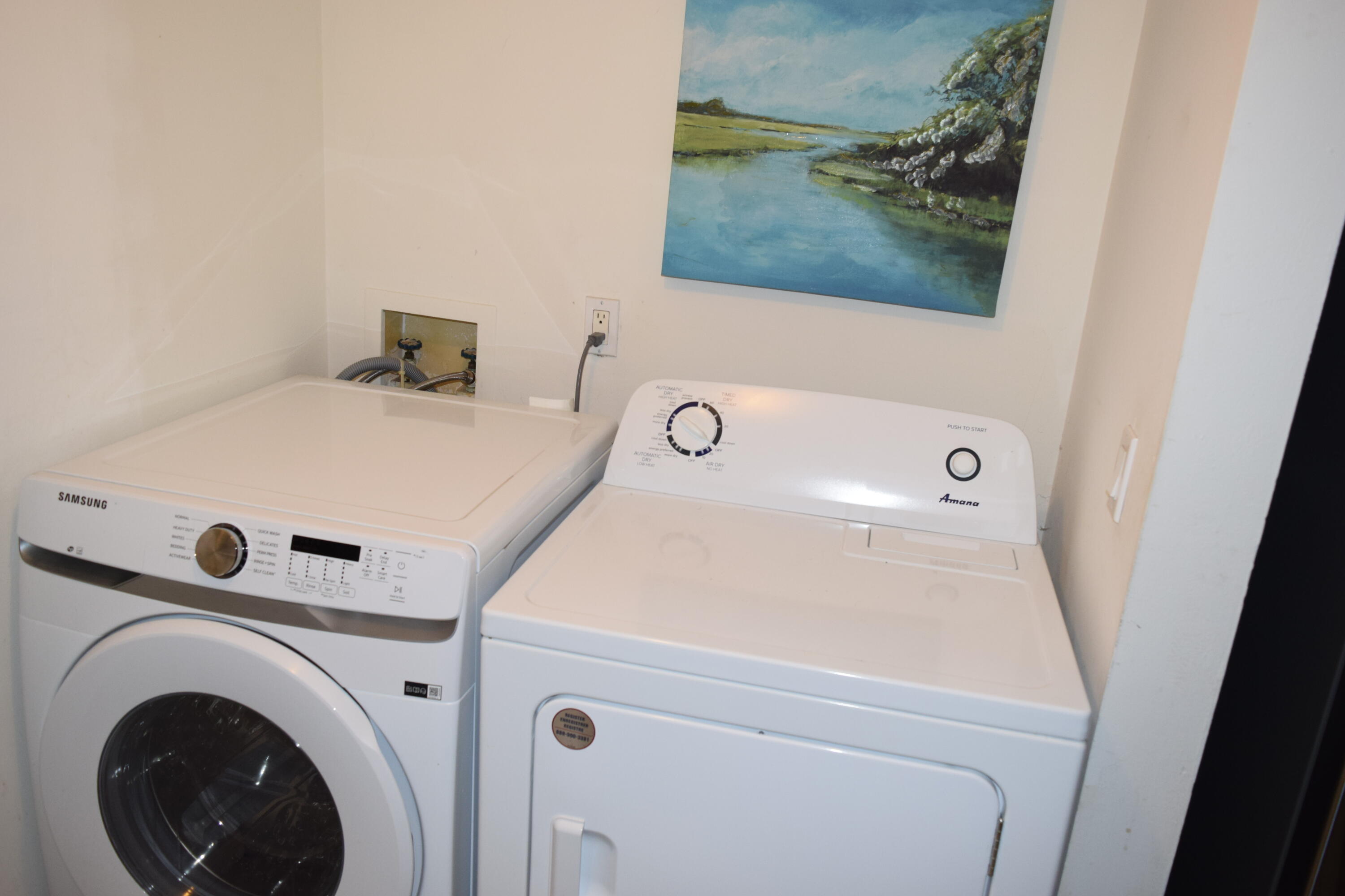 4988 Sable Pine Circle, Unit A2 West Palm Beach, FL 33417 - Photo 24 of 32 a utility room with dryer and washer