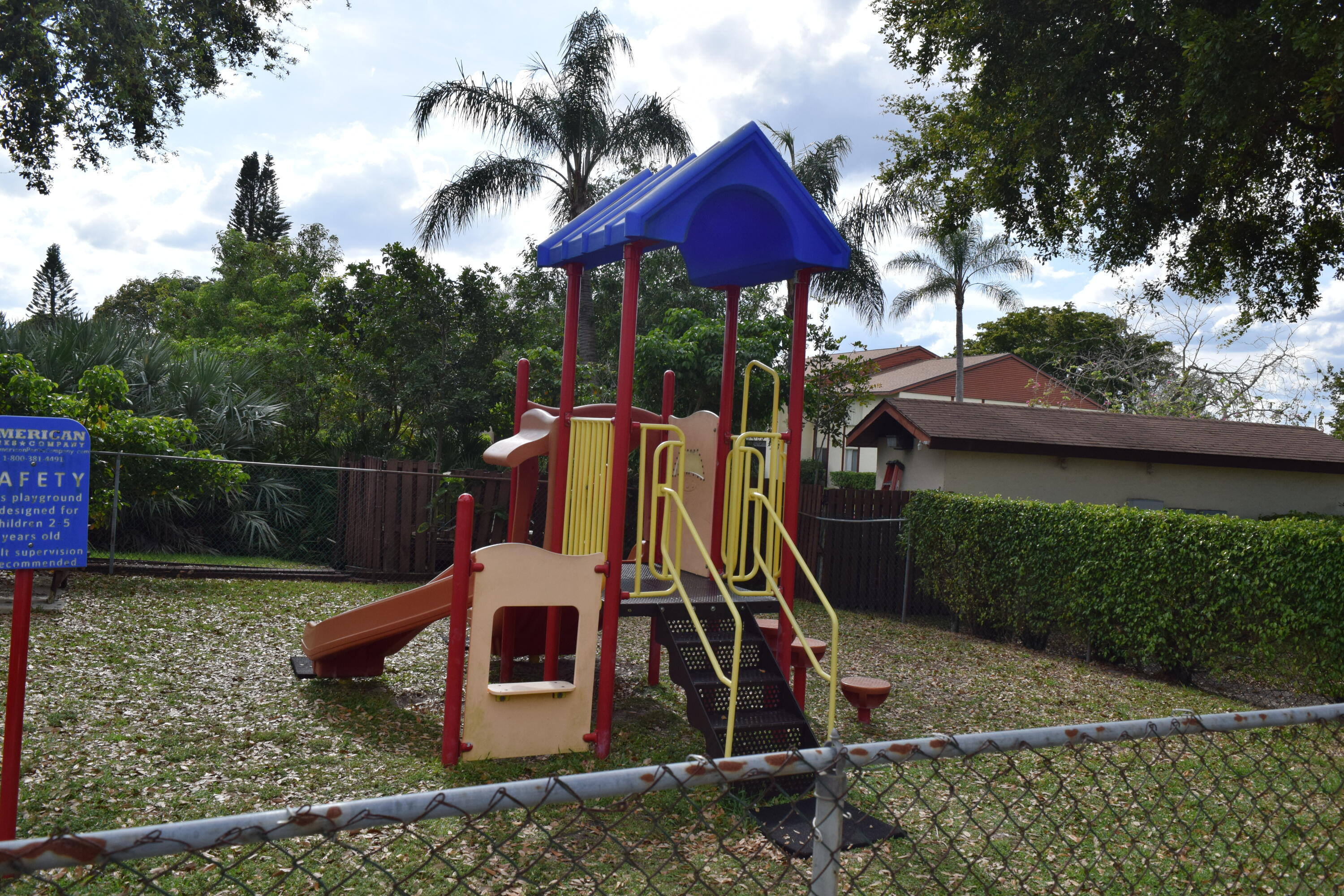 4988 Sable Pine Circle, Unit A2 West Palm Beach, FL 33417 - Photo 28 of 32 a front view of a house with garden