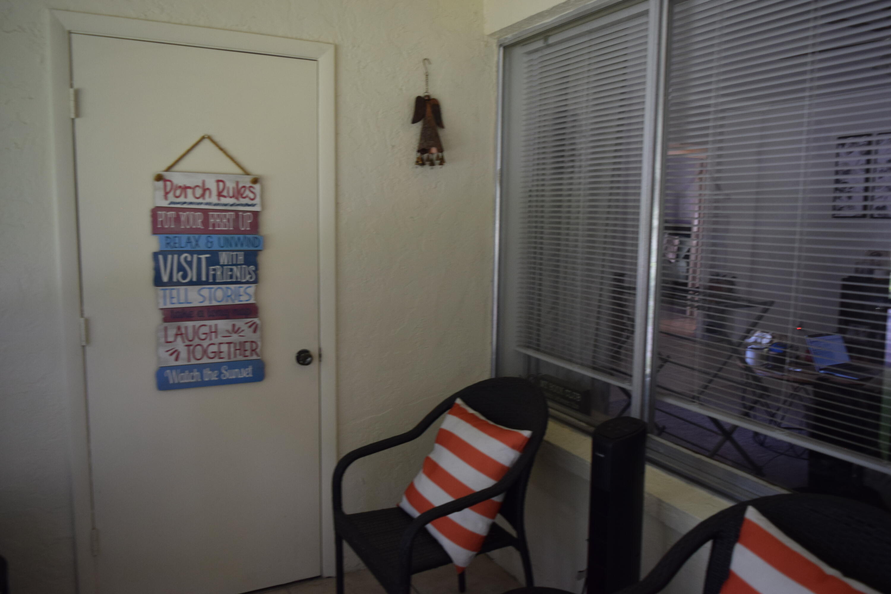 4988 Sable Pine Circle, Unit A2 West Palm Beach, FL 33417 - Photo 3 of 32 a view of a hallway with elevator
