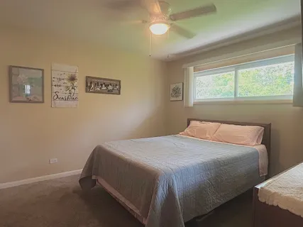 a bedroom with a bed and a shower