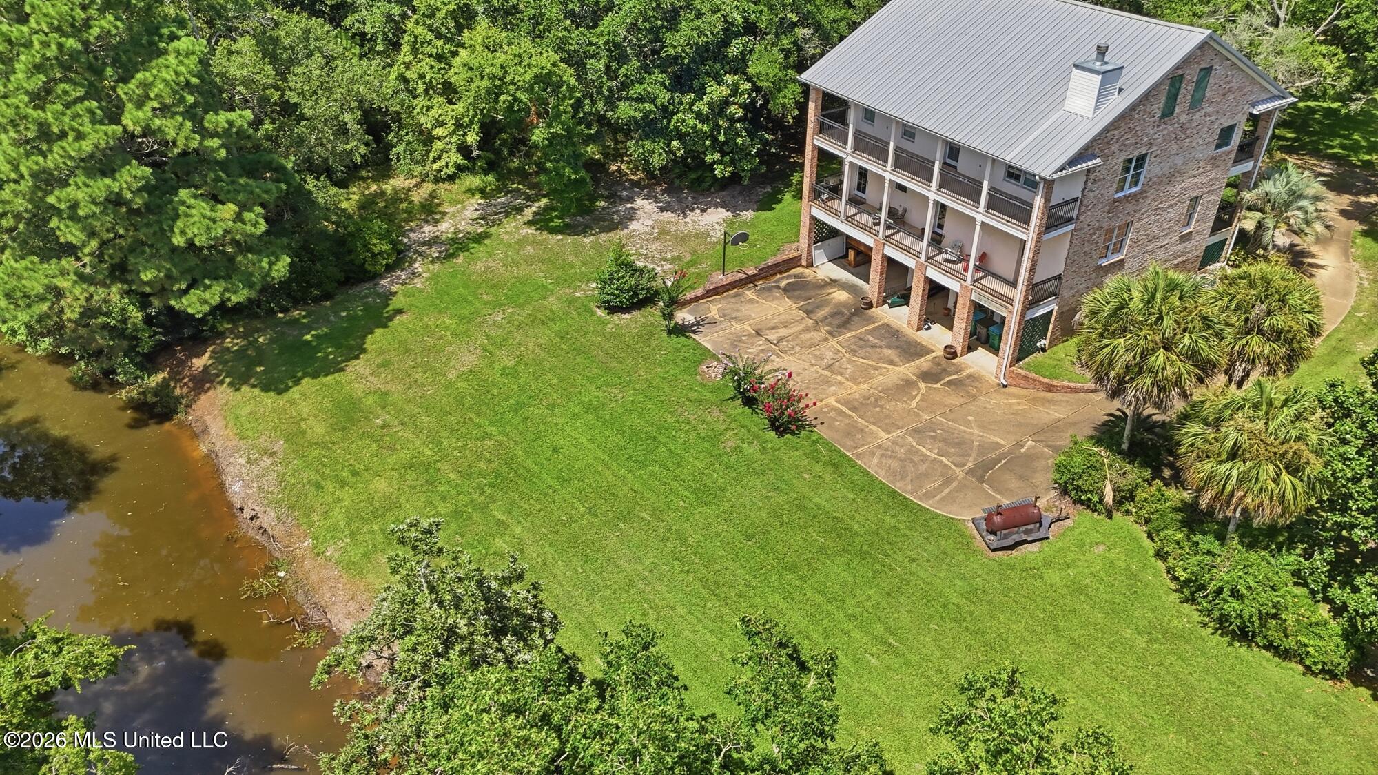 1409 Ladnier Road Gautier, MS 39553 - Photo 5 of 70 69_dji_20260717034113_0052_d