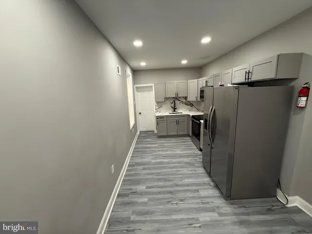 a view of a kitchen from the hallway