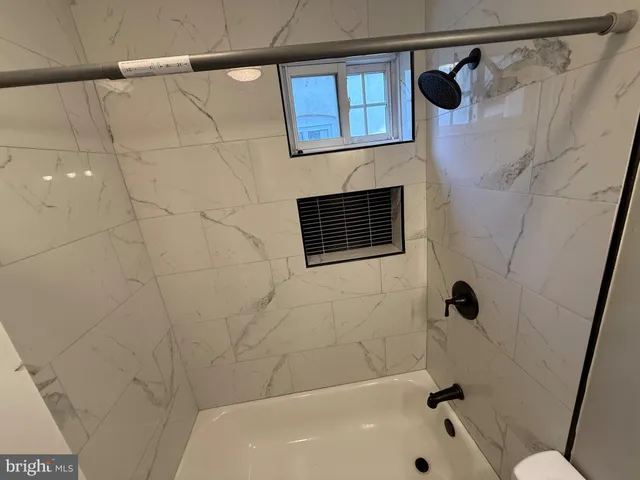 a bathroom with a sink and a bathtub