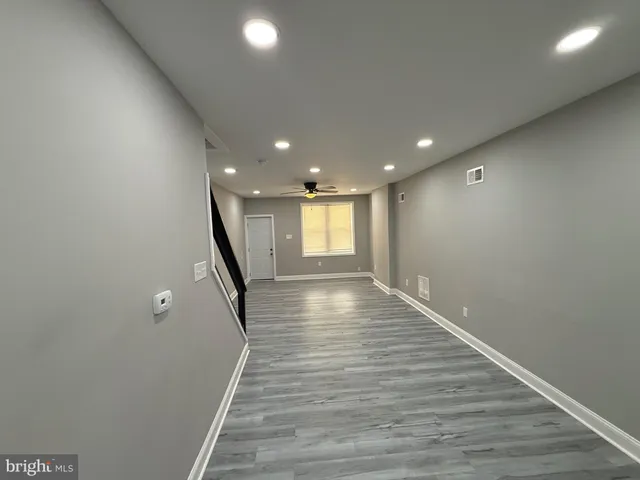 a view of gallery with wooden floor