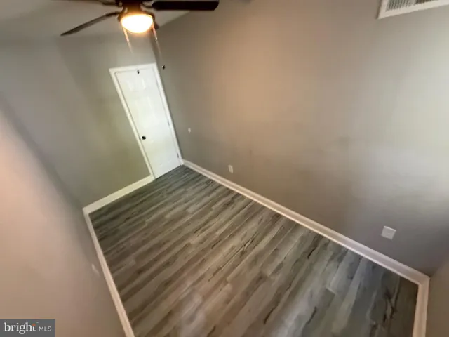 a view of room with window and ceiling fan