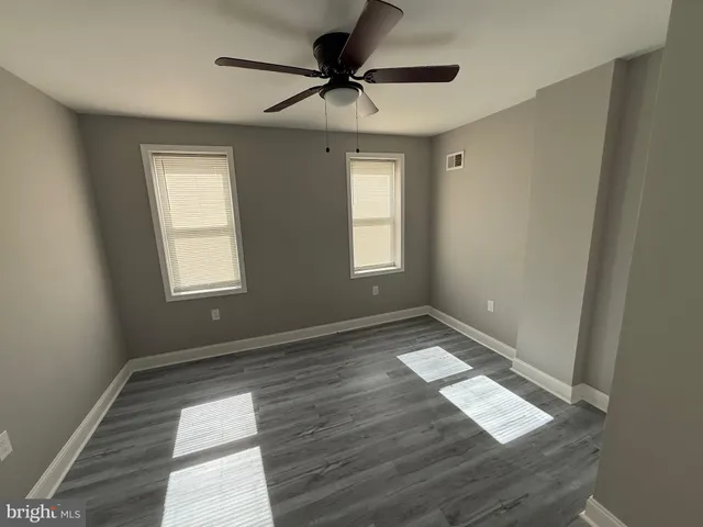 a view of an empty room and window