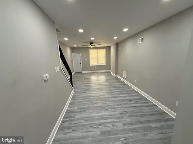 a view of gallery with wooden floor