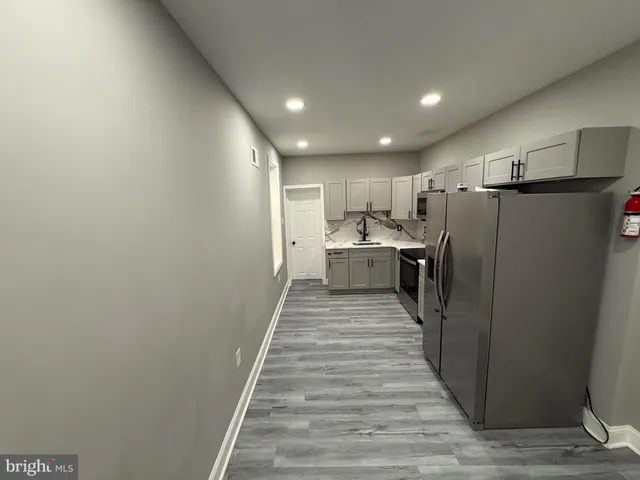 a view of a kitchen from the hallway