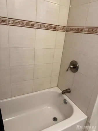 a bathroom with a shower and a shower