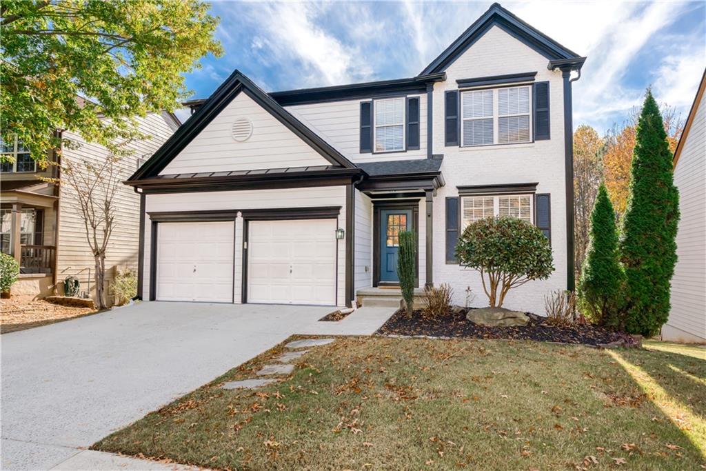 3470 Ridgefair Drive Cumming, GA 30040 - Photo 1 of 1 a view of a house with a yard and potted plants