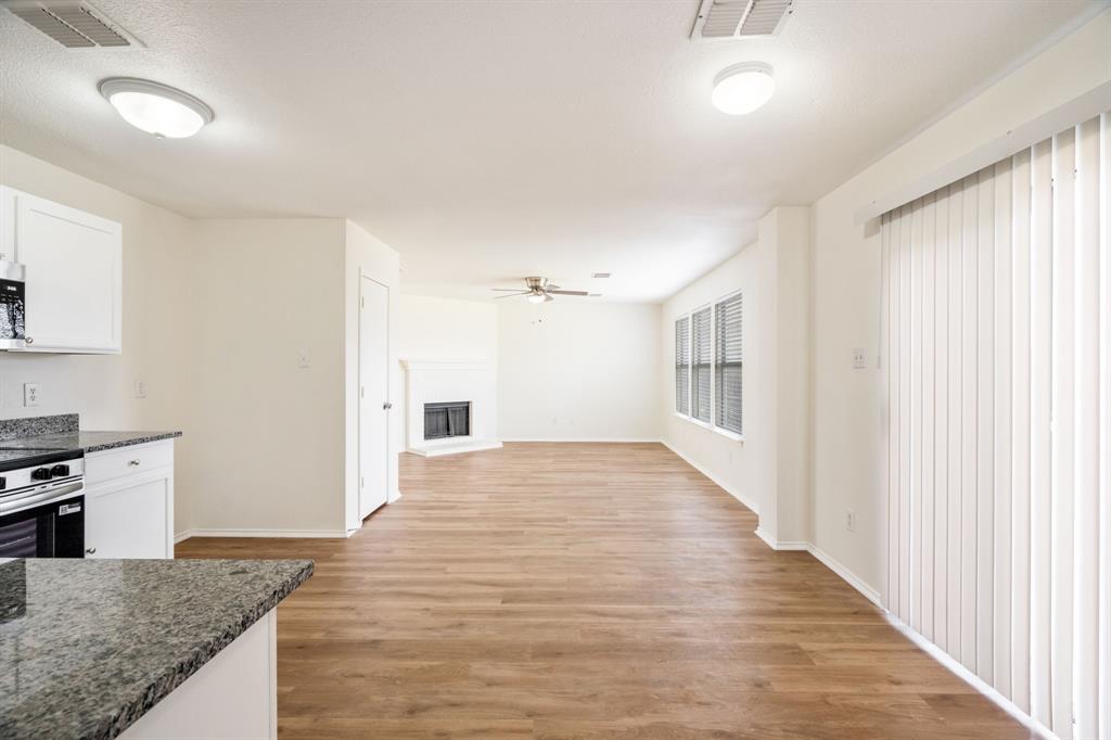 1626 White Oak Road Anna, TX 75409 - Photo 15 of 30 a view of a kitchen cabinets and wooden floor