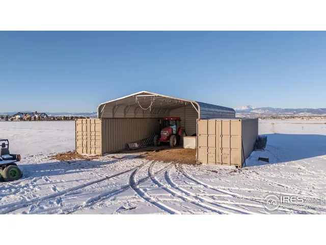 a view of a bedroom with a bed and chair