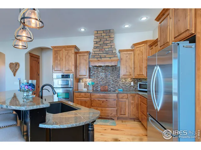a kitchen with a sink cabinets and window