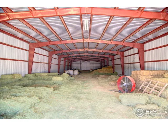 a living room with furniture rug and window