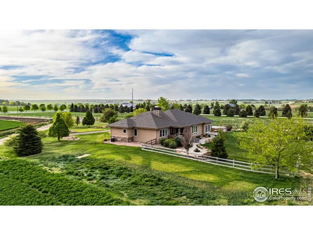 a view of an house with a big yard