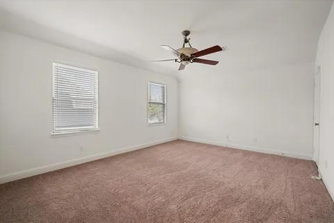 a view of a big room with carpet