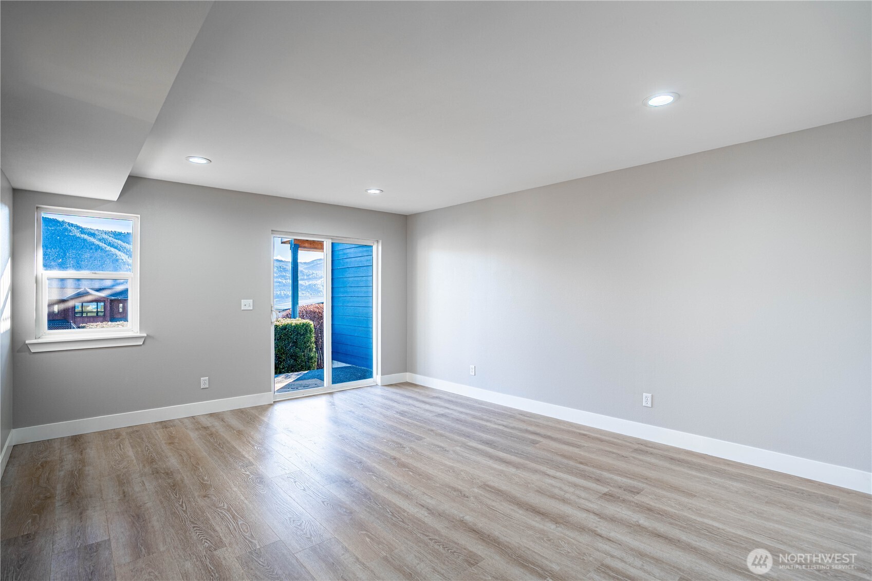 744 Wapato Way, Unit B Manson, WA 98831 - Photo 20 of 32 a view of an empty room with wooden floor