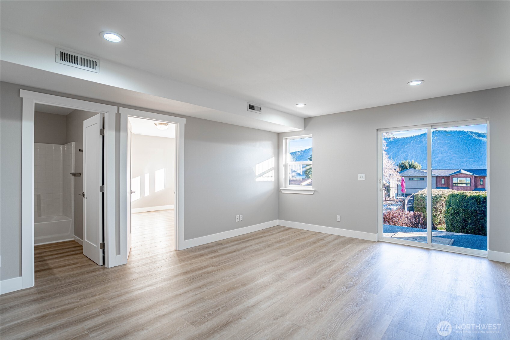 744 Wapato Way, Unit B Manson, WA 98831 - Photo 21 of 32 a view of a room with wooden floor and window