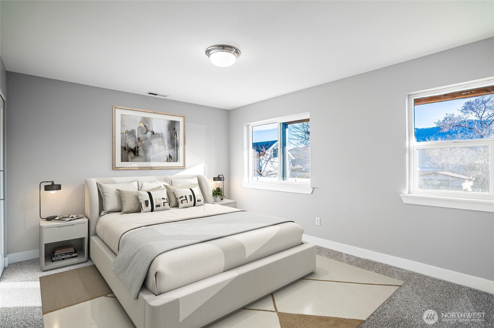 744 Wapato Way, Unit B Manson, WA 98831 - Photo 22 of 32 a bedroom with a large bed and a window