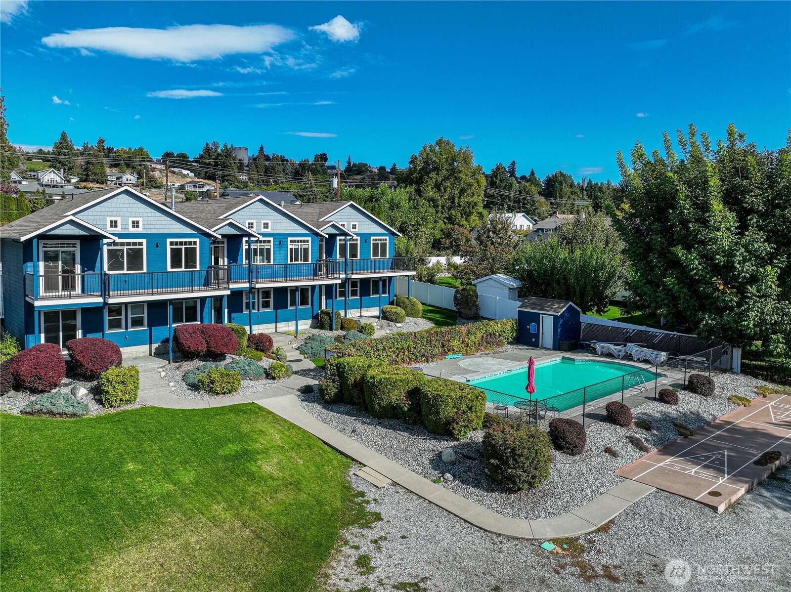 744 Wapato Way, Unit B Manson, WA 98831 - Photo 29 of 32 a front view of a house with garden and porch