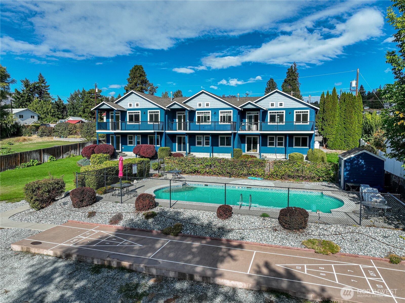744 Wapato Way, Unit B Manson, WA 98831 - Photo 30 of 32 a front view of a house with garden