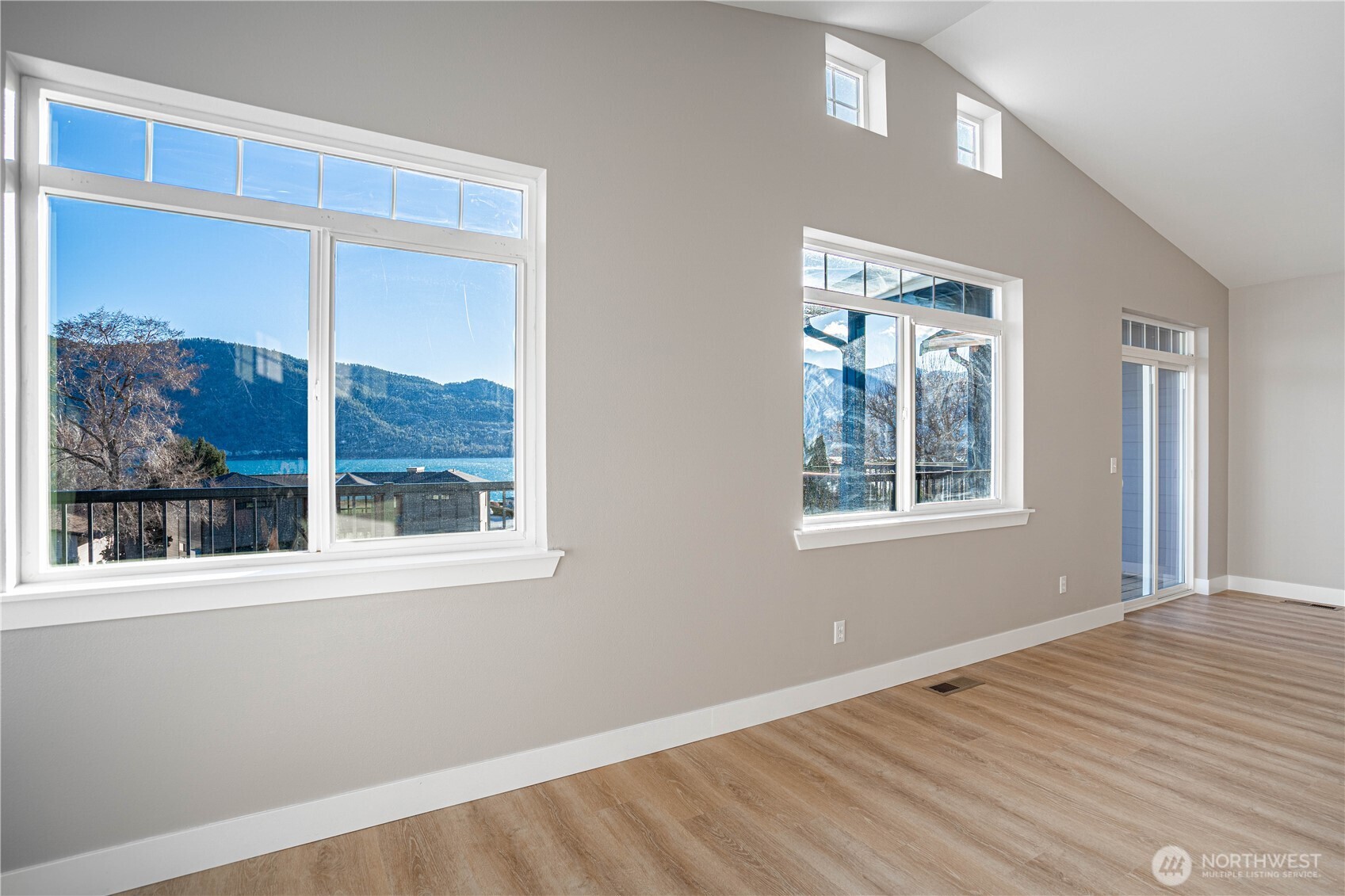744 Wapato Way, Unit B Manson, WA 98831 - Photo 5 of 32 a view of an empty room with a window
