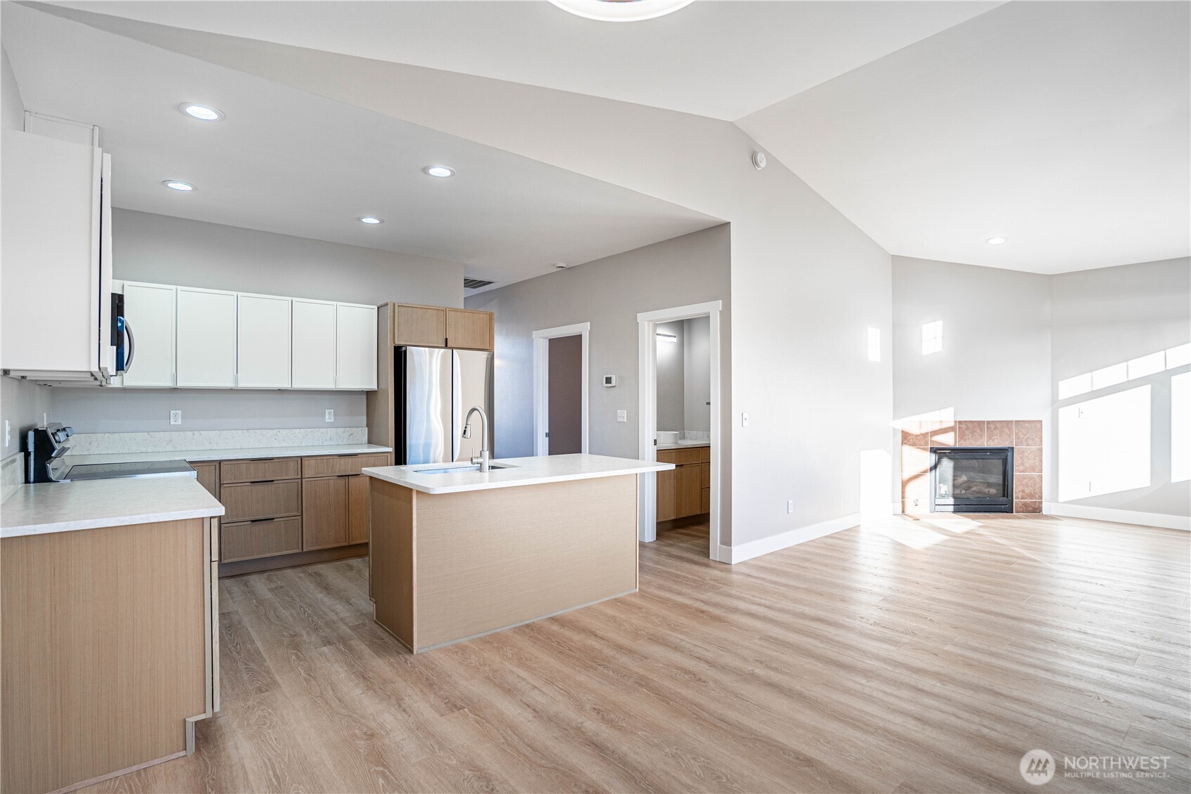 744 Wapato Way, Unit B Manson, WA 98831 - Photo 6 of 32 a view of kitchen with cabinets and wooden floor