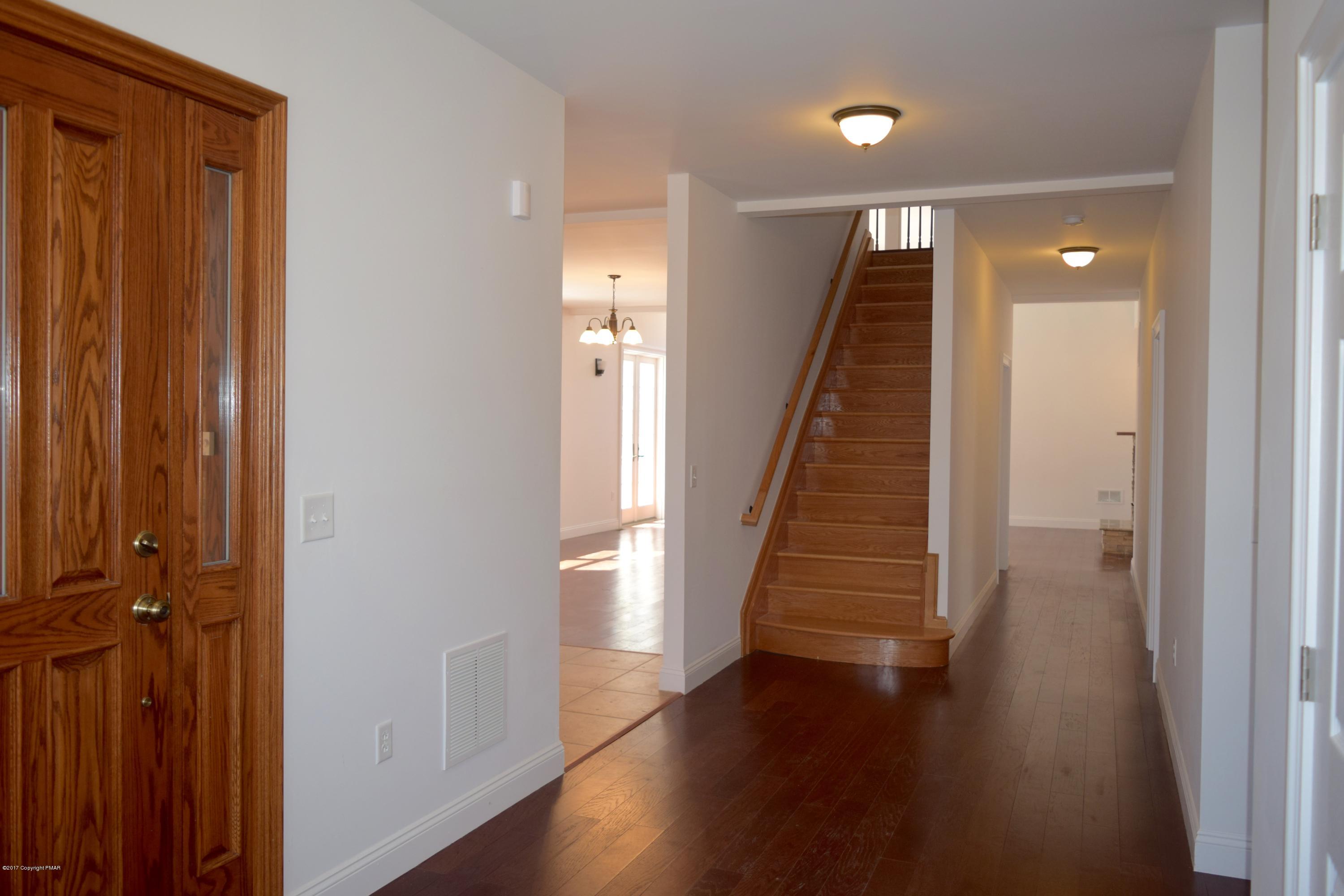 503 Barrys Road Effort, PA 18330 - Photo 14 of 48 a view of a hallway with wooden floor and staircase
