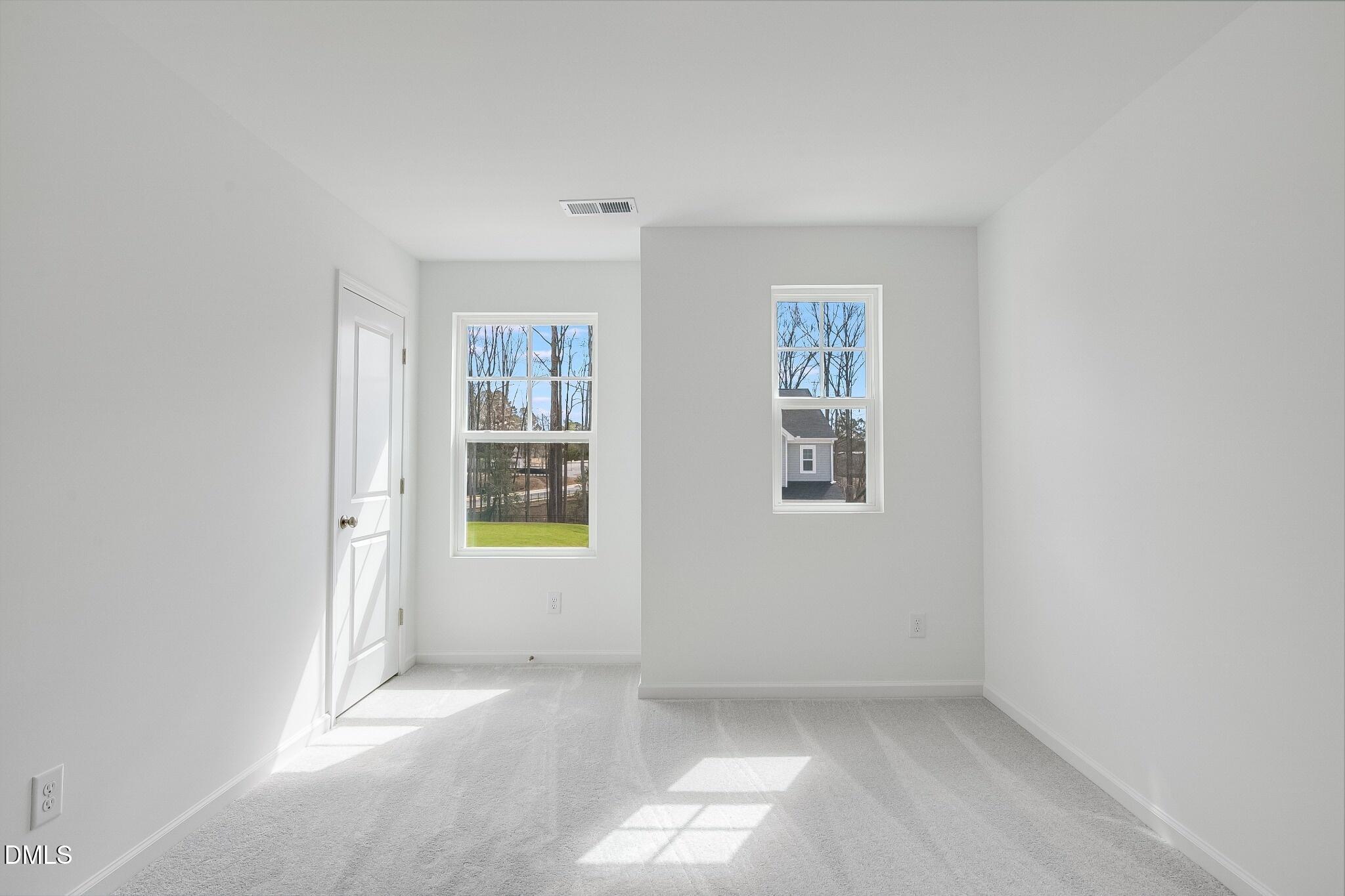 1004 Red Finch Way Angier, NC 27501 - Photo 19 of 42 an empty room with windows