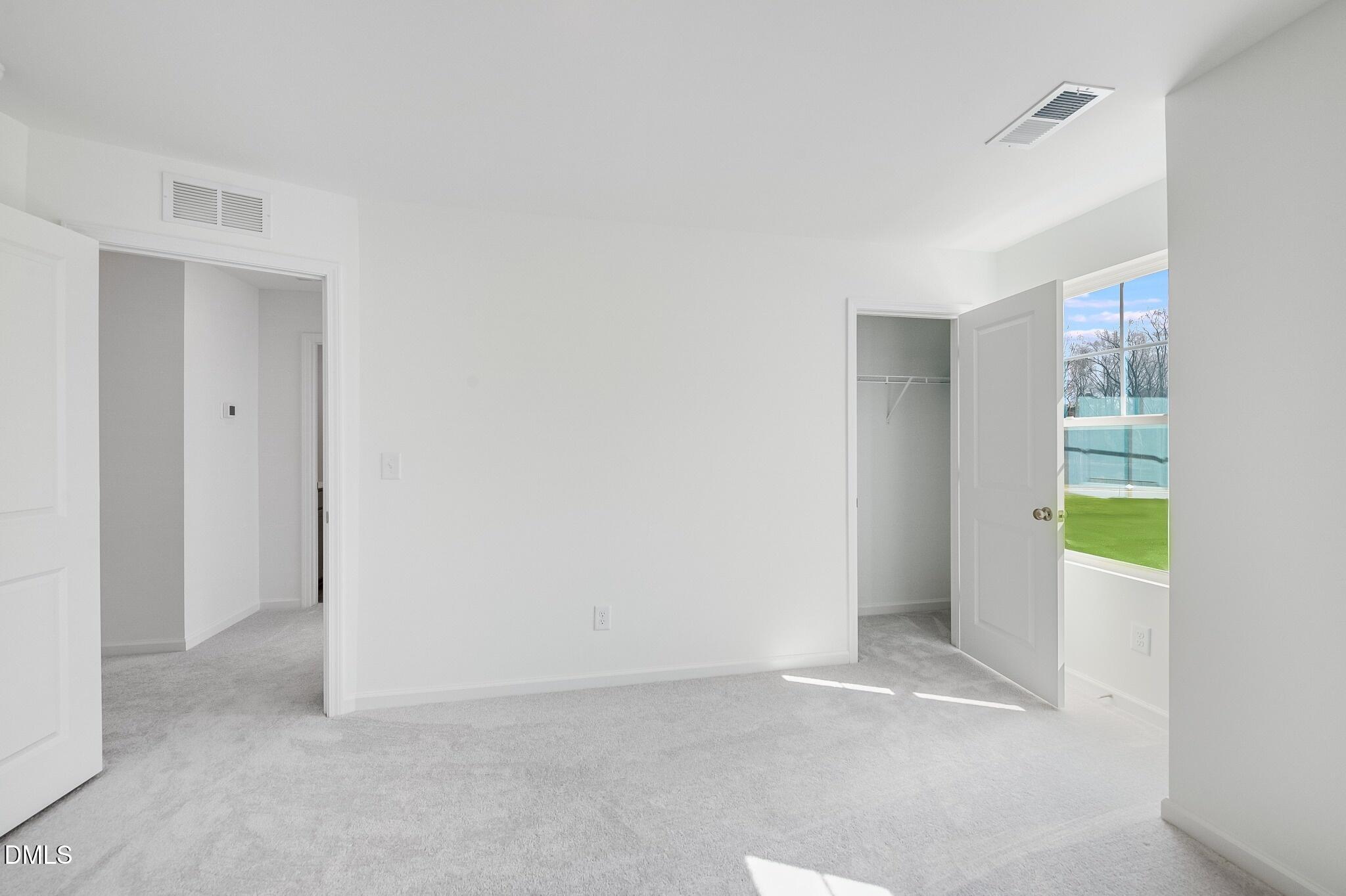 1004 Red Finch Way Angier, NC 27501 - Photo 20 of 42 a view of an empty room with a kitchen