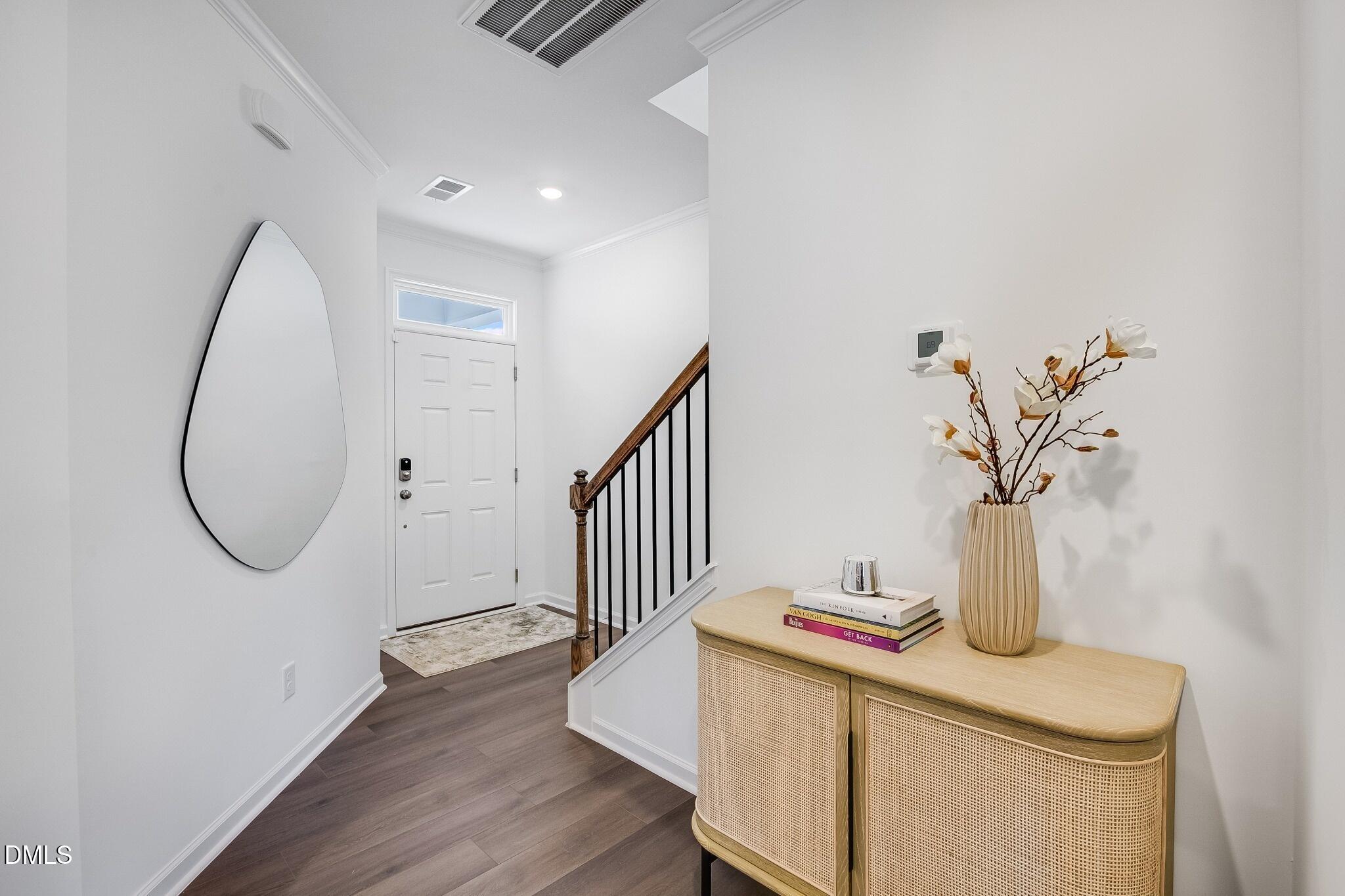1004 Red Finch Way Angier, NC 27501 - Photo 2 of 42 a view of a room with wooden floor and staircase