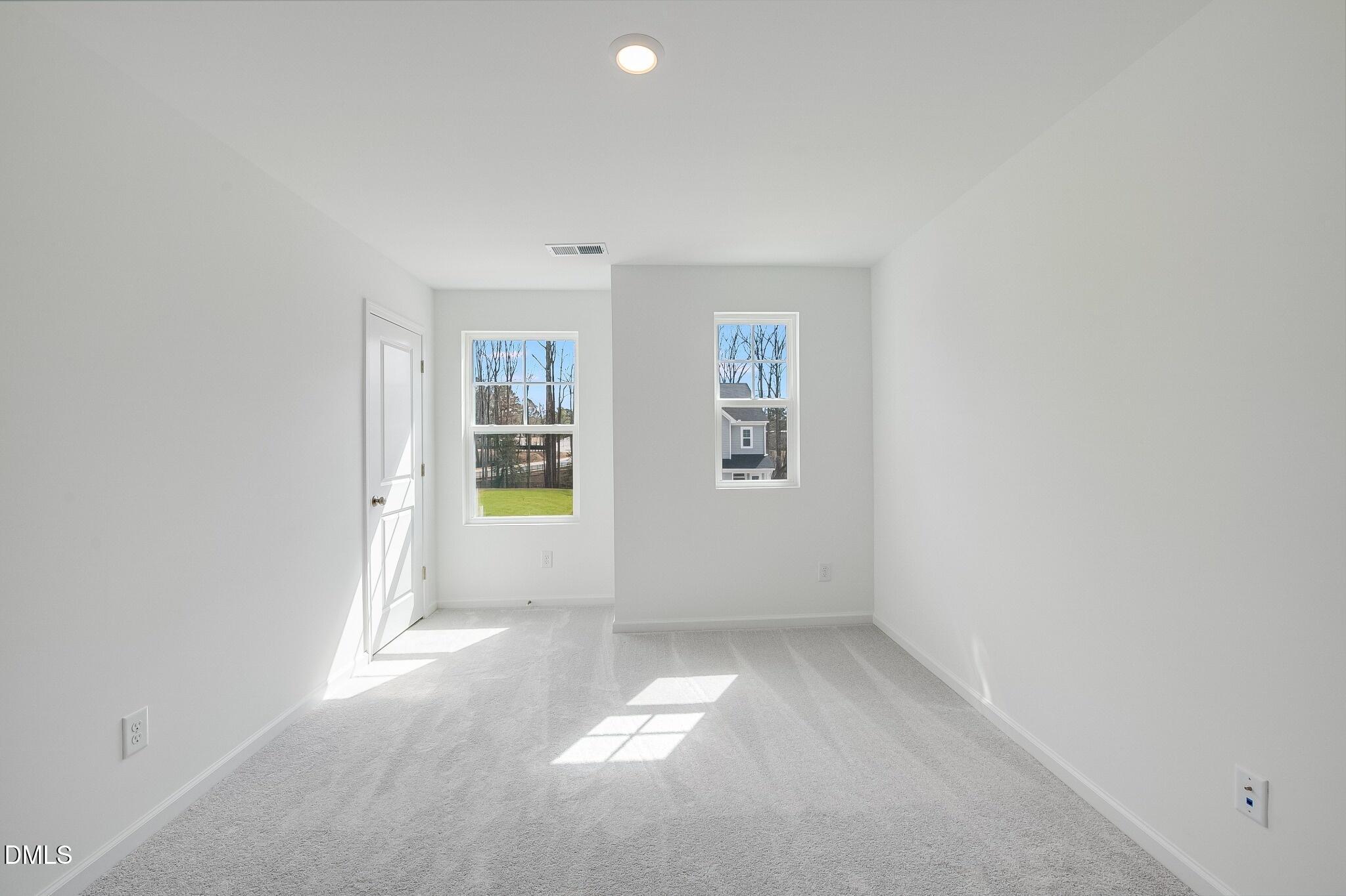 1004 Red Finch Way Angier, NC 27501 - Photo 21 of 42 an empty room with windows